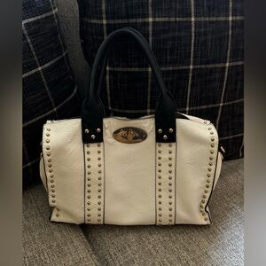 White Purse Roomy & includes a purse has some peeling near closure.
